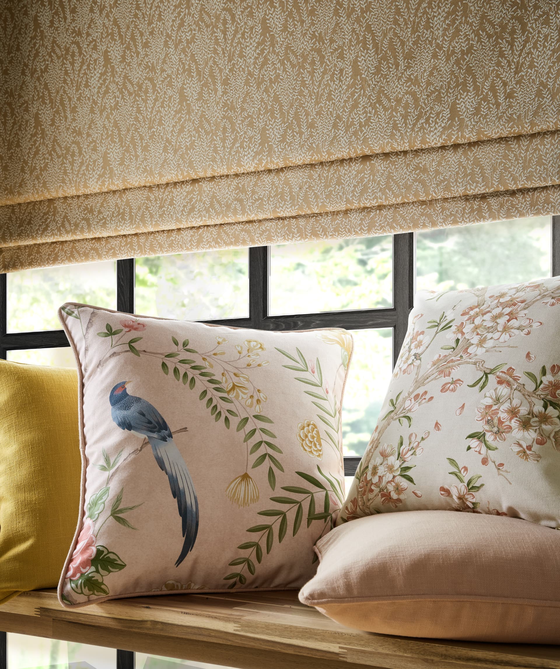 A collection of decorative cushions in different fabrics